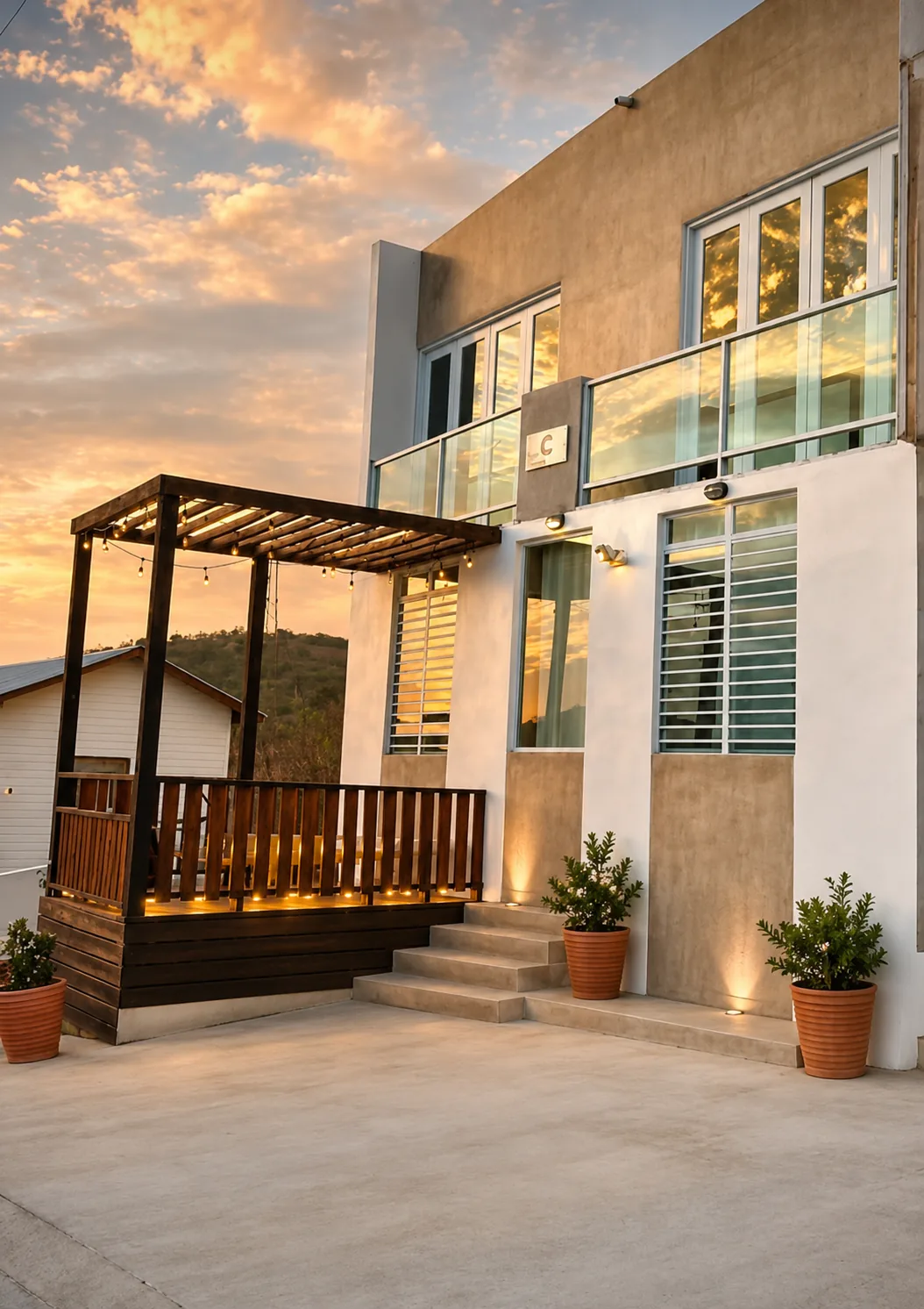 Casa Carmen entrance and Rota terrace at sunset