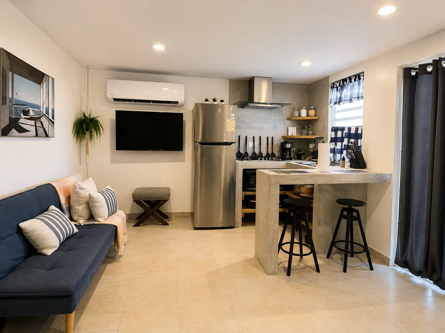 Rota living room with sofa bed, TV and open kitchen