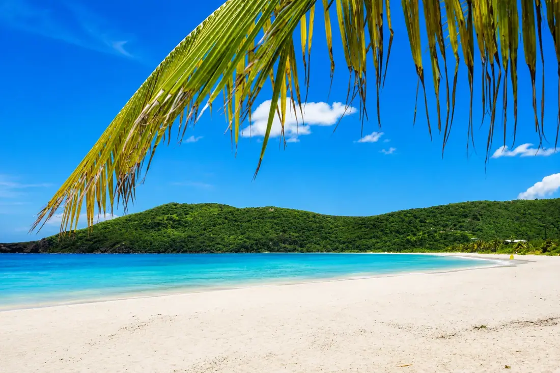 Sweeping view of Flamenco Beach's horseshoe bay