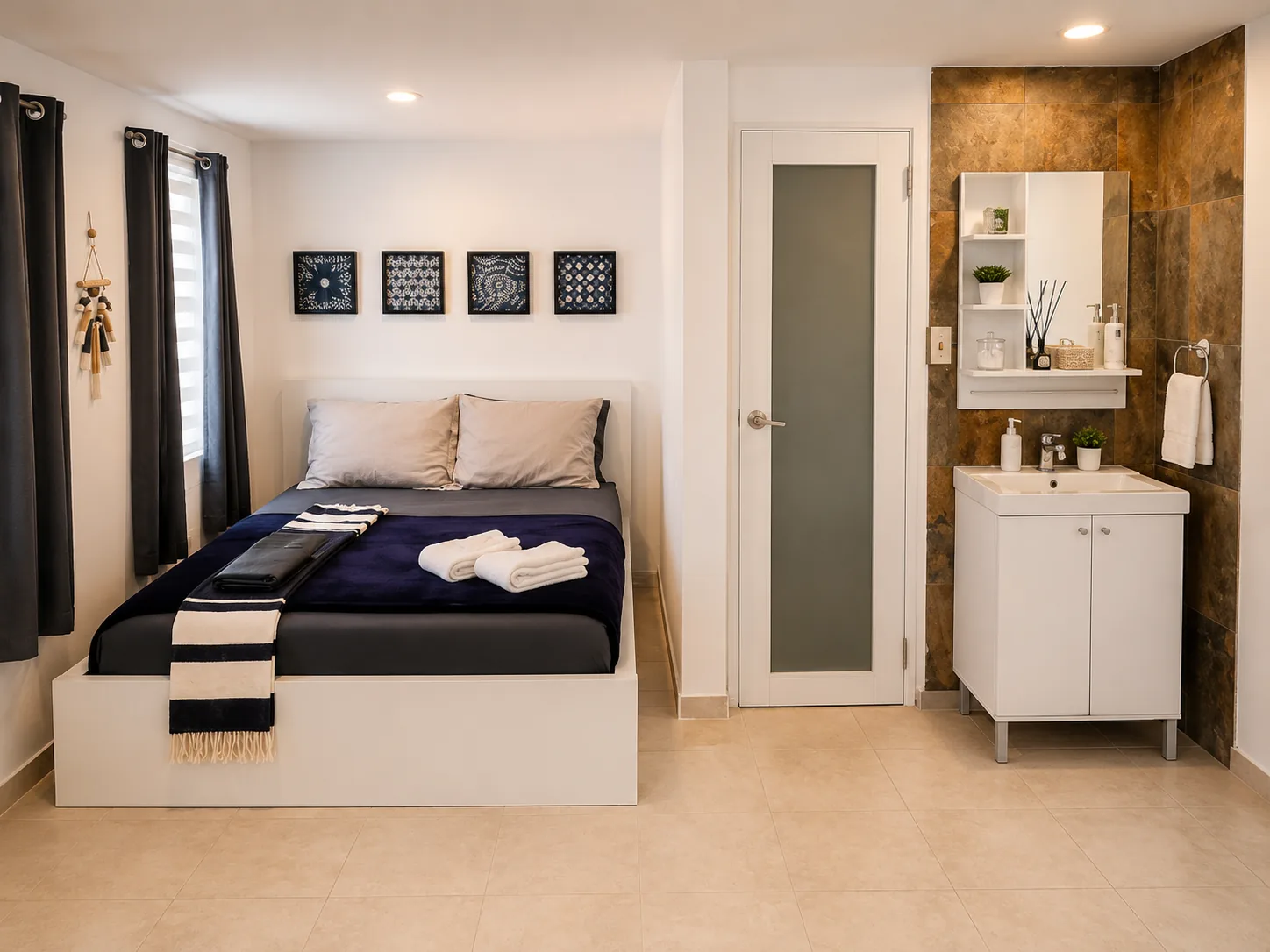 Rota bedroom with queen bed, vanity and bathroom entrance
