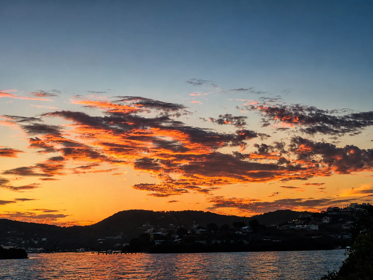 Vivid orange sunset over the hills and waters of Culebra